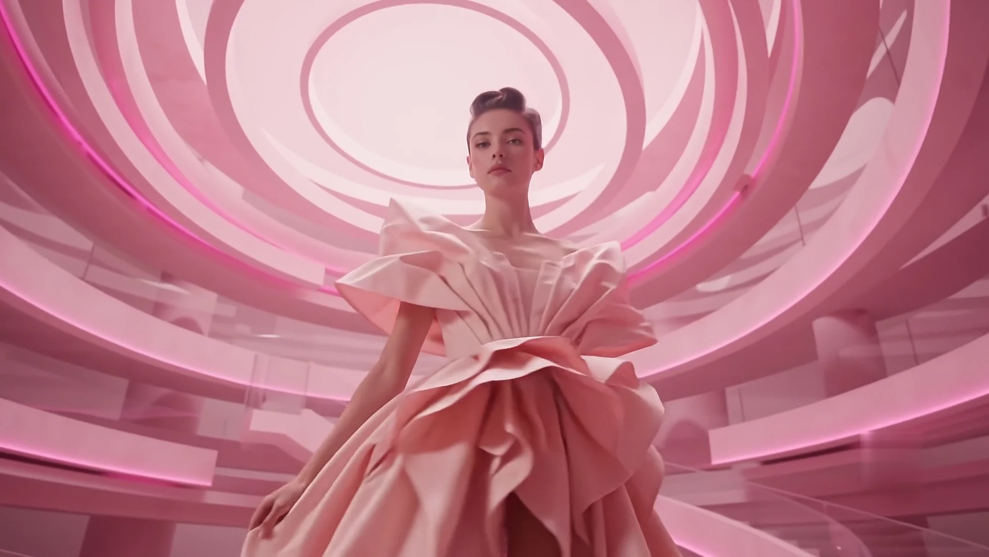The gown reshaped into a sculptural ruffled shoulder and tiered skirt, seen from low in the rotunda