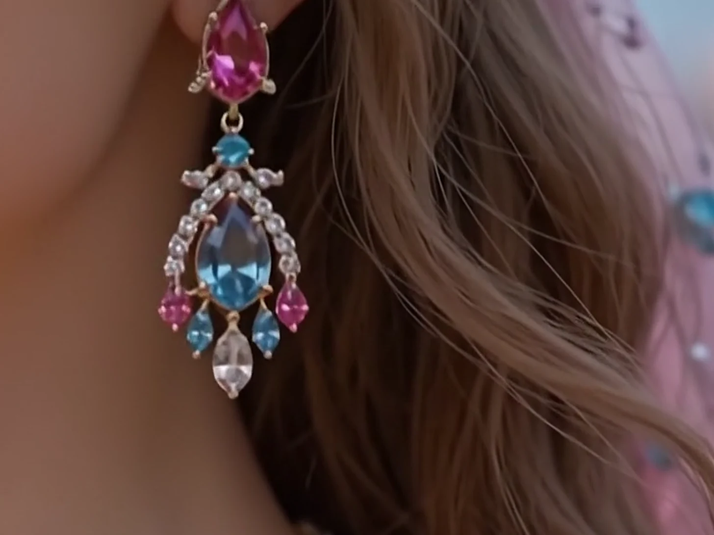 An aquamarine, pink sapphire and diamond drop earring